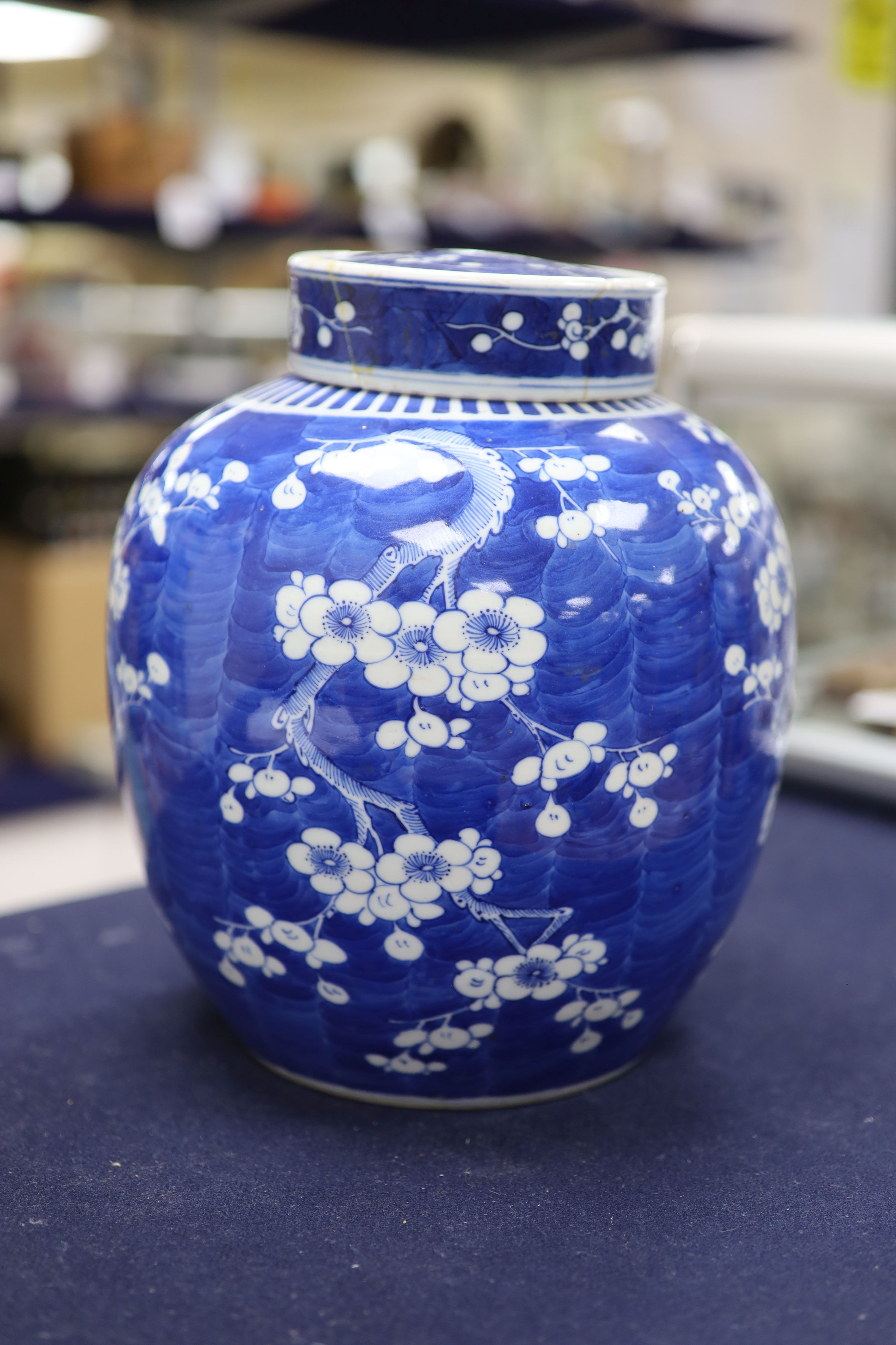 An early 20th century Chinese blue and white prunus jar and cover, height 26cm